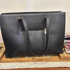 Sleek Black Leather Tote with Metallic Accents